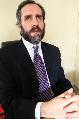 Professional photo of Martin Fleming wearing a business suit